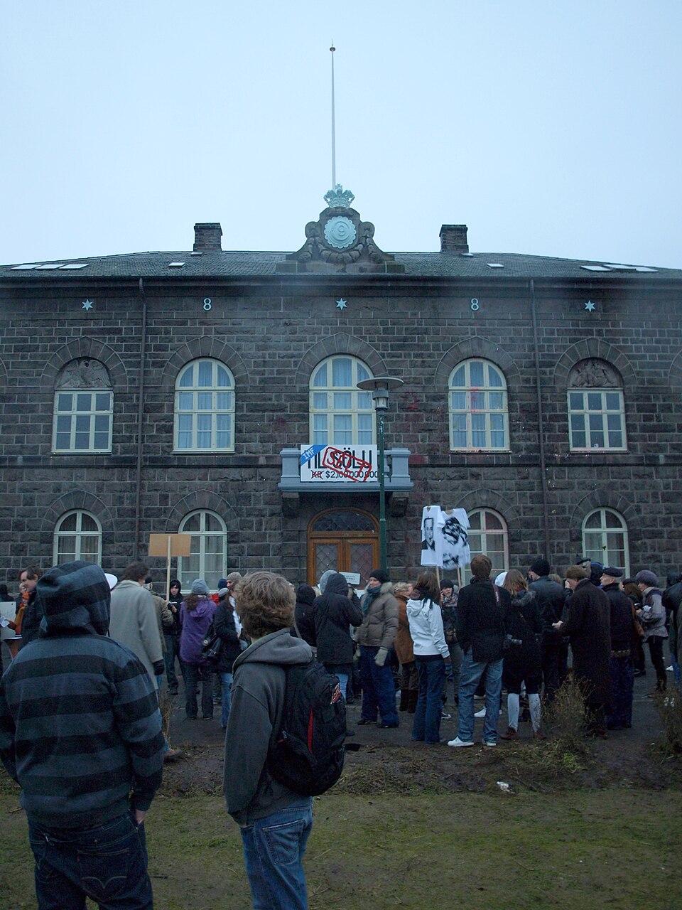 Banner reading 'For Sale' attached to Iceland's parliament building during a 2008 protest