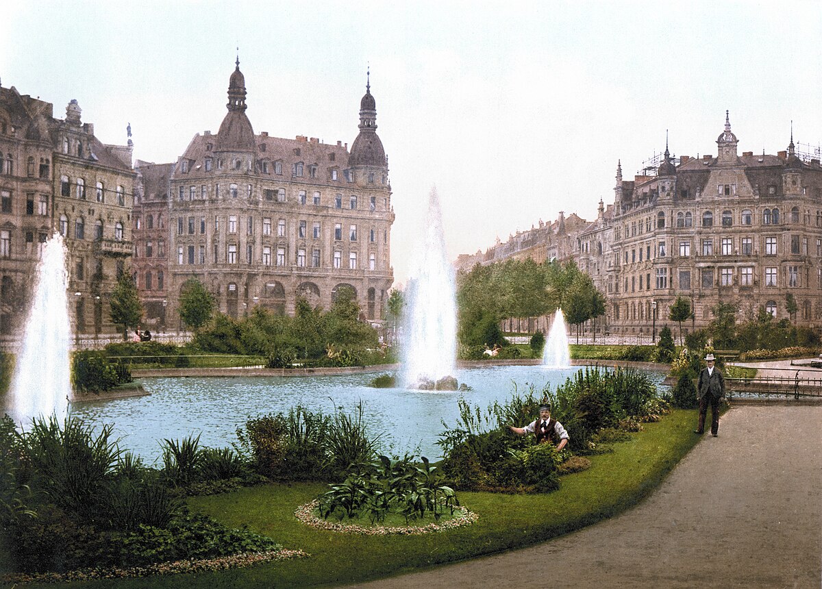 Photochrom view of Der Deutsche Ring along the Rhine in Cologne around 1900, with cathedral spires in the distance