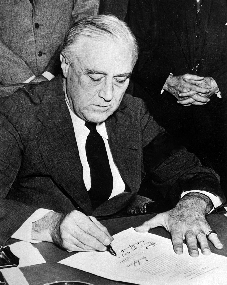 President Franklin D. Roosevelt signing legislation