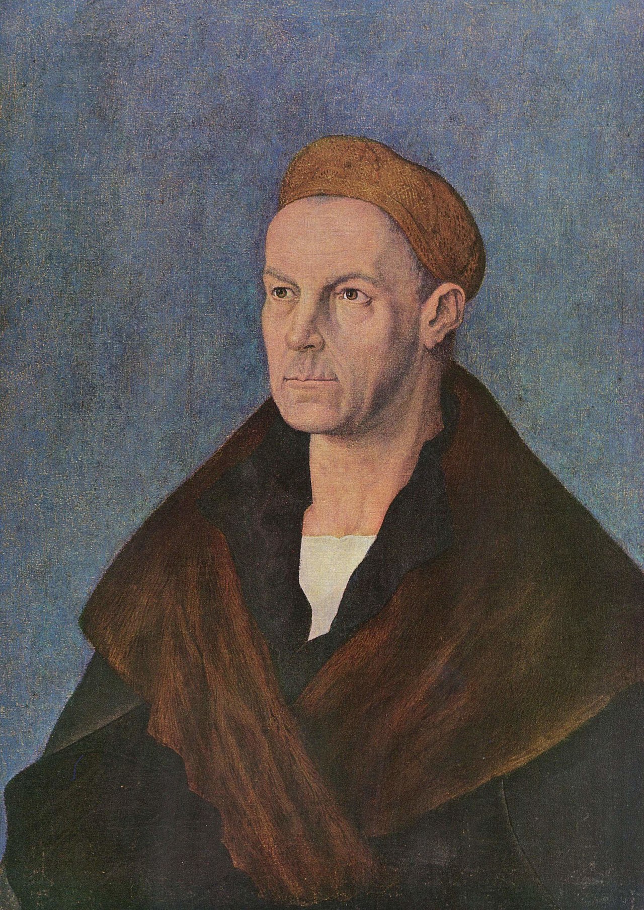 Half-length Renaissance portrait of a sober middle-aged man in a fur-collared dark coat, wearing a gold-embroidered cap, set against a green background.